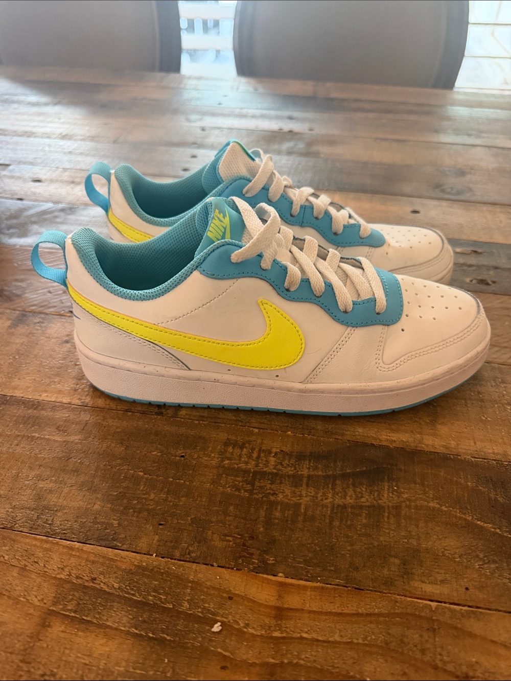 Nike Kids White Sneakers with Neon Yellow Swoosh and Teal Accents